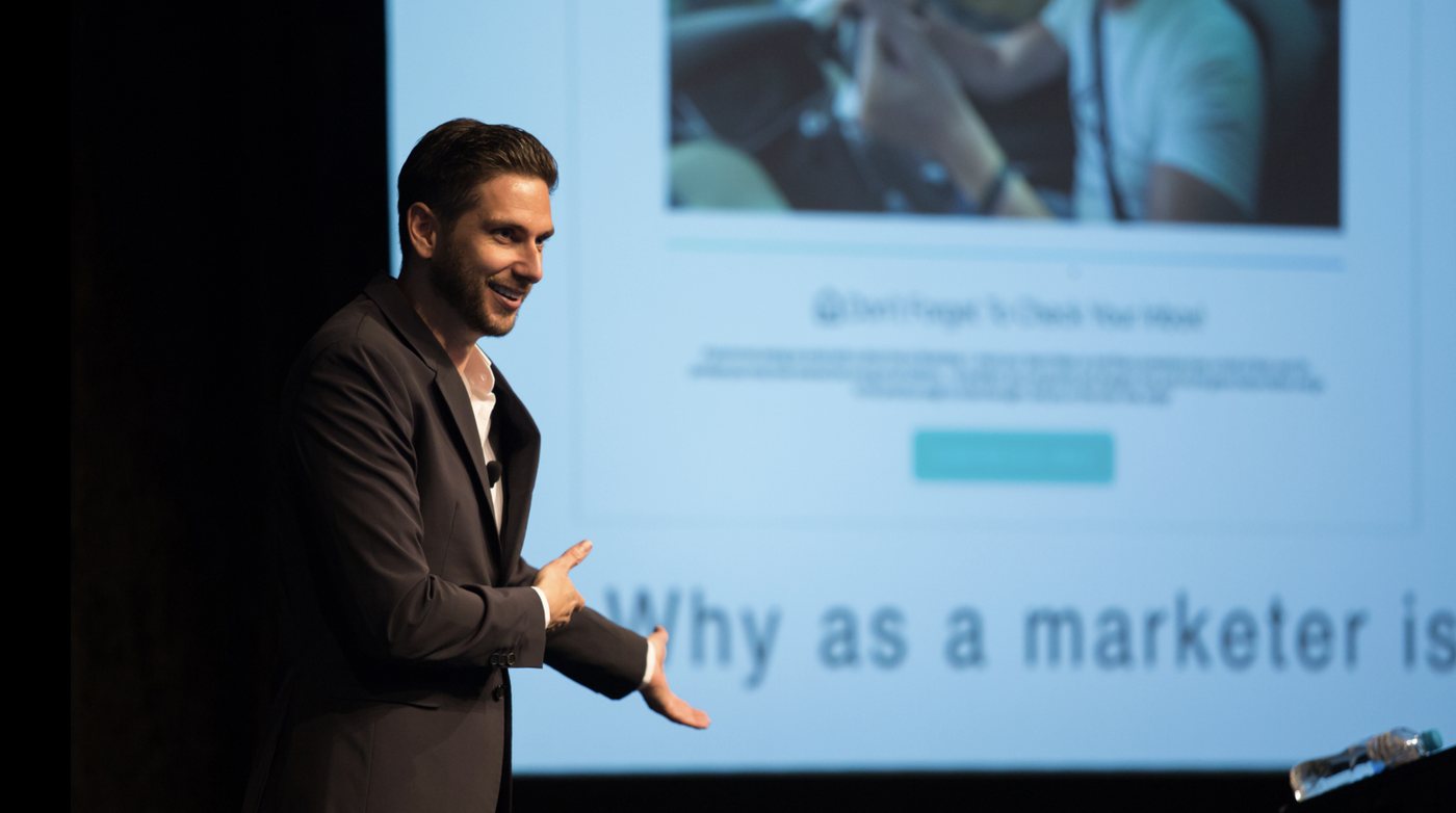 Stuart Ross speaking on stage